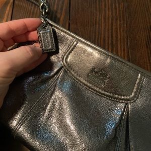 Metallic coach wristlet